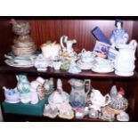 A quantity of model cottages, relief decorated jugs, model animals, part teasets, figures and
