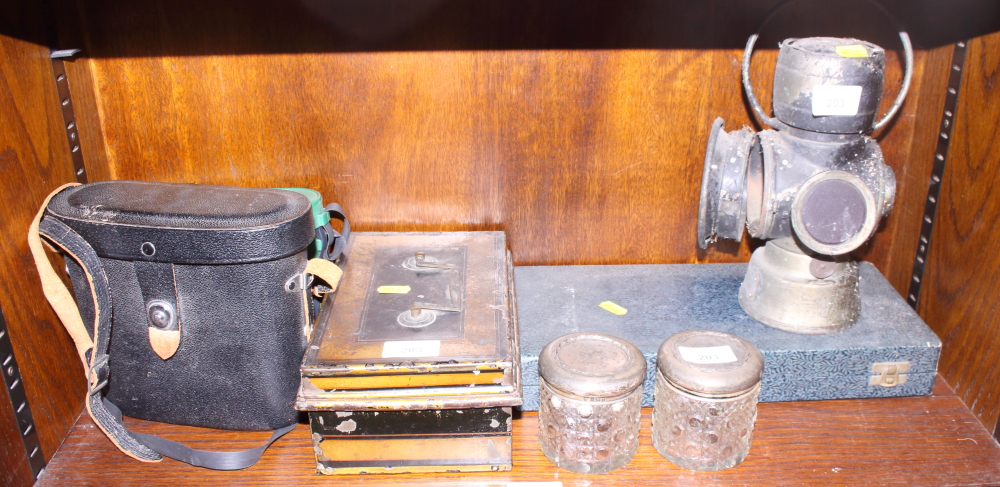 Two pairs of binoculars, a cash tin, a silver plated dessert service, two silver topped glass