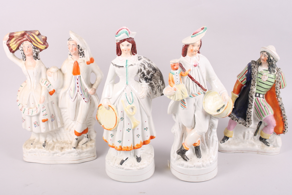 A pair of 19th century Staffordshire figures, drummer boy and girl trumpet player, 14" high, and two
