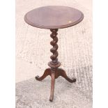 A mid 19th century walnut circular top occasional table, on barley twist tripod splay support, 18