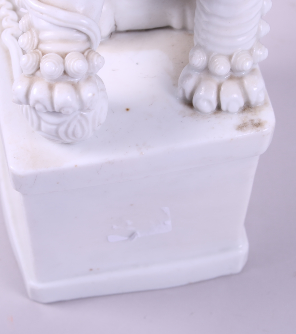 A pair of Chinese porcelain blanc de chine temple lions, on square bases, 11" high - Image 4 of 7