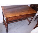 A 19th century carved oak hall table, on turned and stretchered supports, 45" wide