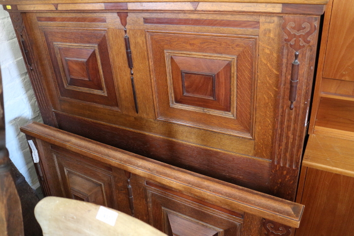 Two pairs of oak and walnut inlaid single bed ends of 17th century design with field panels and