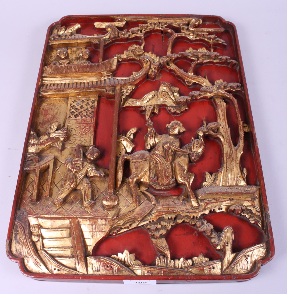 A Chinese red lacquered and gilt carved wood bed panel, decorated figures and buildings, 17" x 13"