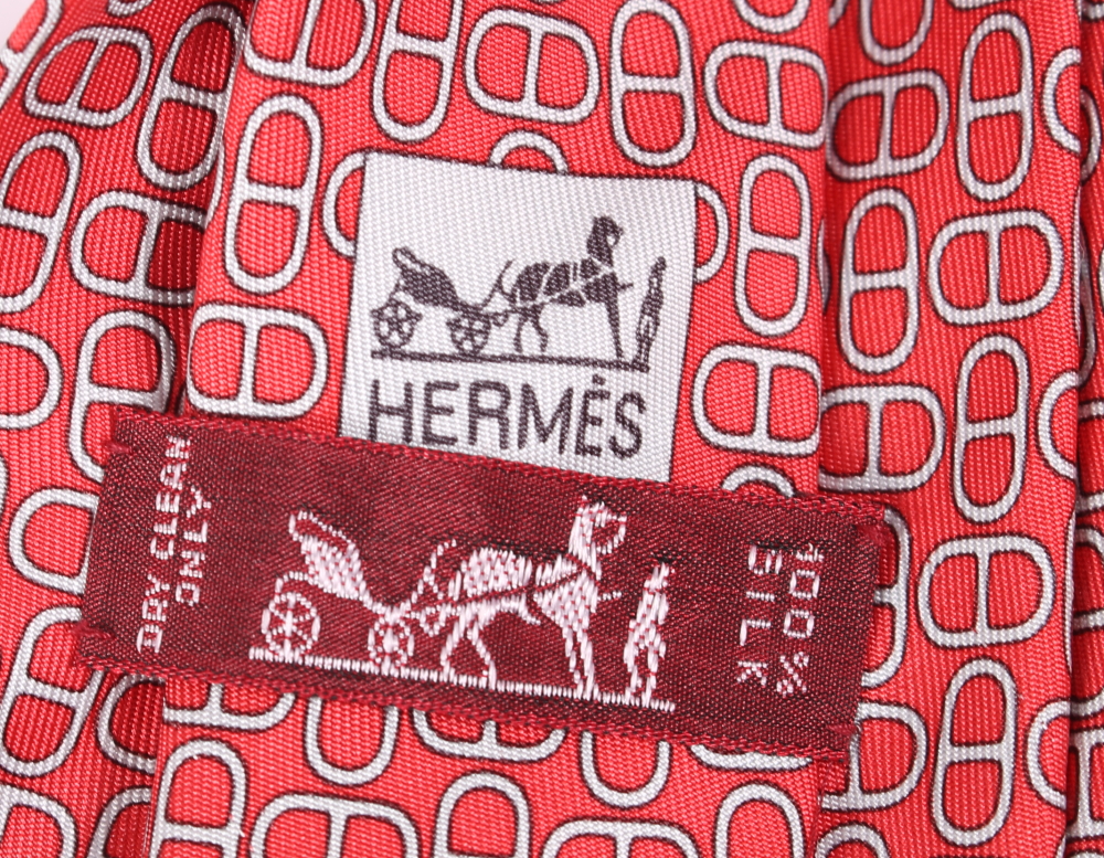 A Hermes silk tie with all-over red and grey geometric pattern, complete with box - Image 2 of 2