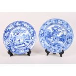 A 19th century blue and white plate, decorated shepherd and shepherdess resting under a tree, and