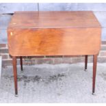 An early 19th century mahogany Pembroke table, fitted one drawer, on square taper castored supports,
