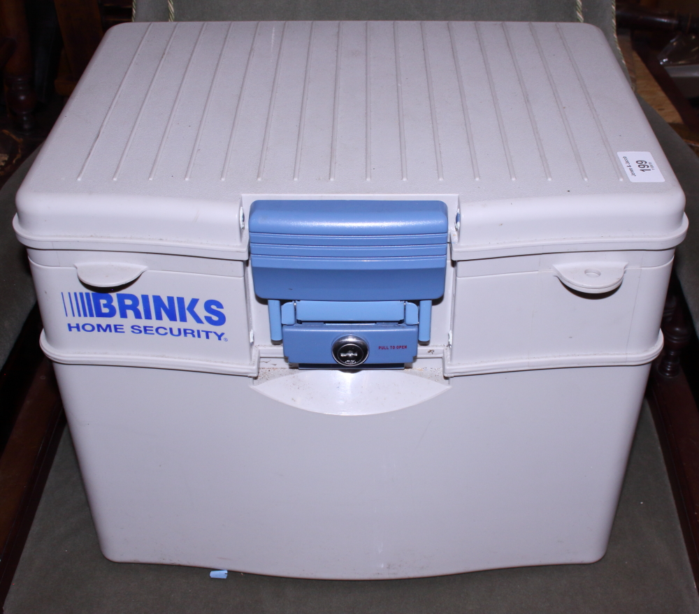 A Brinks home security safe box with two keys
