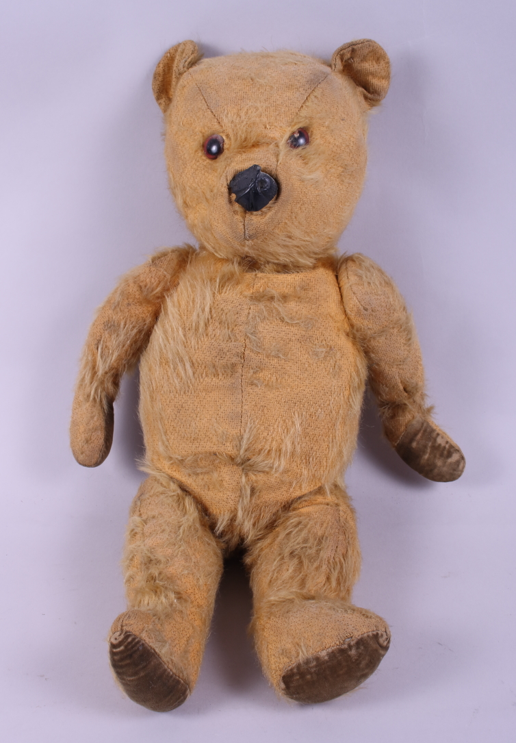 A mid 20th century gold plush teddy bear, 19" high