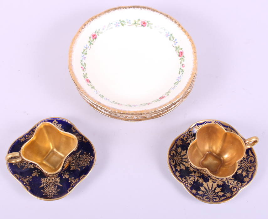 A pair of Coalport blue and gilt cabinet cups and four Ridgeways saucers with floral and gilt