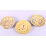 A pair of Chinese porcelain dishes, decorated dragons on a yellow ground, six character marks to