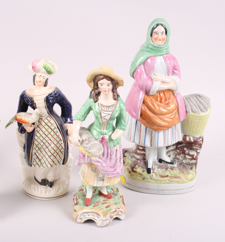 A 19th century Staffordshire figure, fish wife, a smaller figure, Spanish lady, and five other - Image 2 of 7