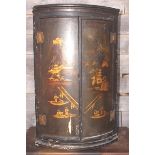 A mid 18th century chinoiserie lacquered bowfront corner cupboard enclosed two figure decorated