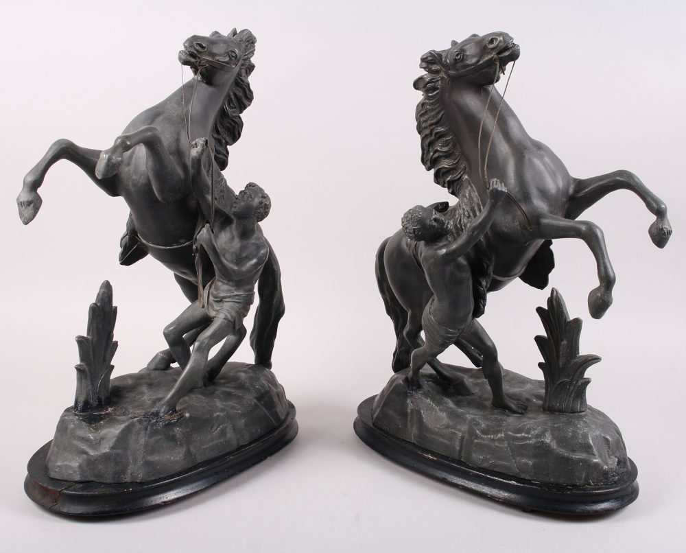 A pair of Spelter Marley horses, on wooden stands, 16 1/2" high