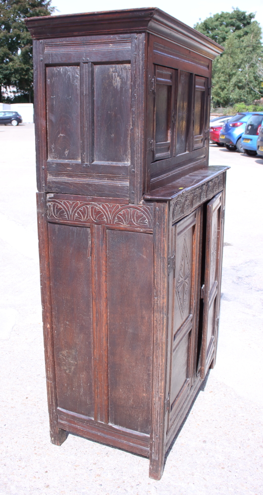 A late 17th century carved oak duedarn, the upper section enclosed two doors over two further doors, - Image 2 of 3