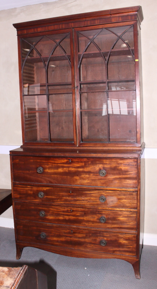 A late Georgian mahogany secretaire bookcase, the upper section enclosed two Gothic lattice glazed