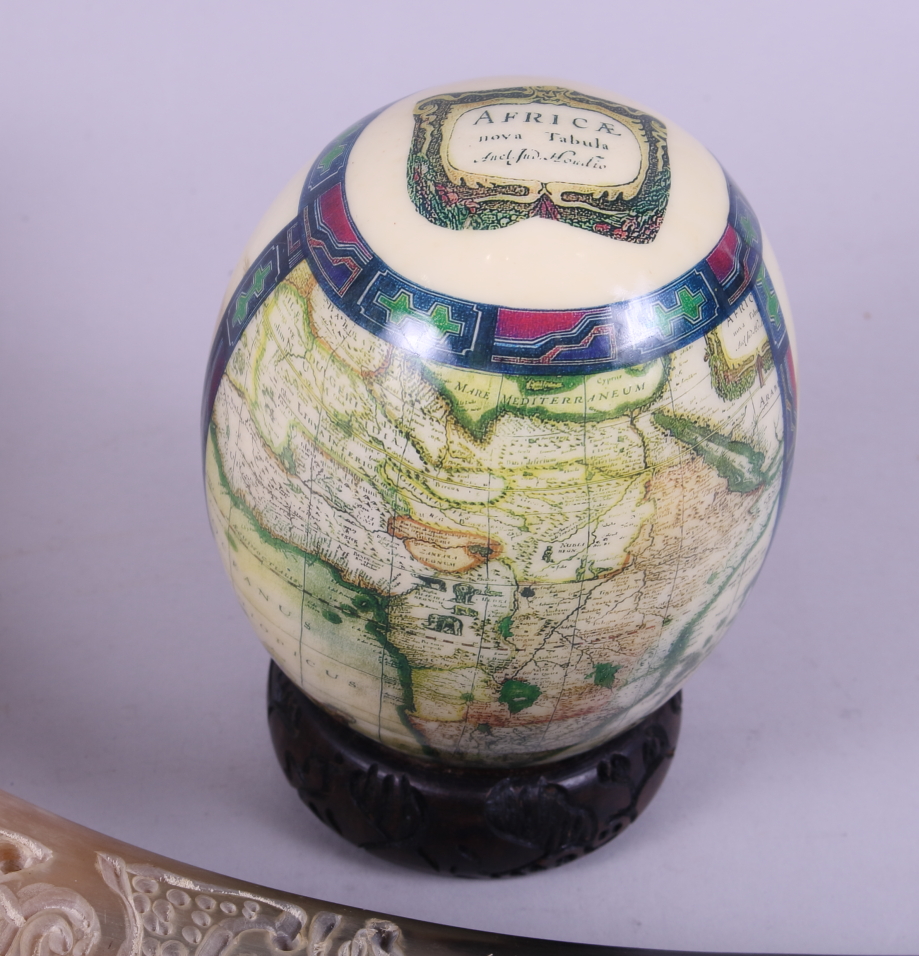 An ostrich egg, decorated with a map of Africa and indigenous animals, a carved buffalo horn and - Image 2 of 6