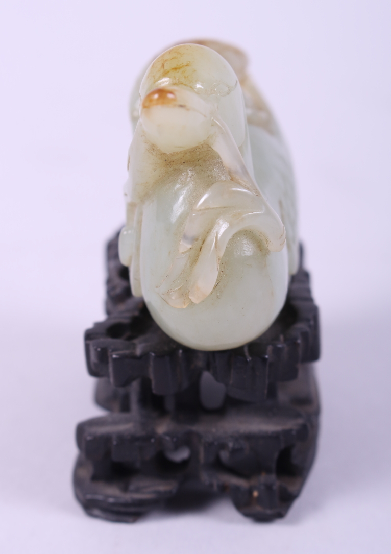 A Chinese carved pale celadon jade figure of a duck, 2 3/4" long, on associated carved hardwood - Image 3 of 22