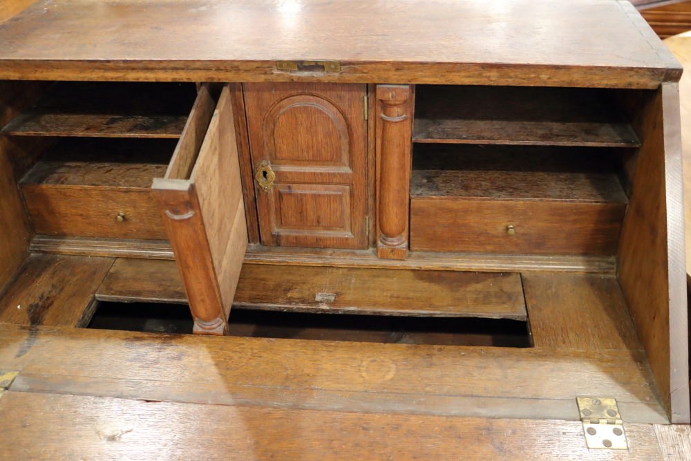 An 18th century oak provincial fall front bureau with fitted interior with well, over two drawers - Image 3 of 3