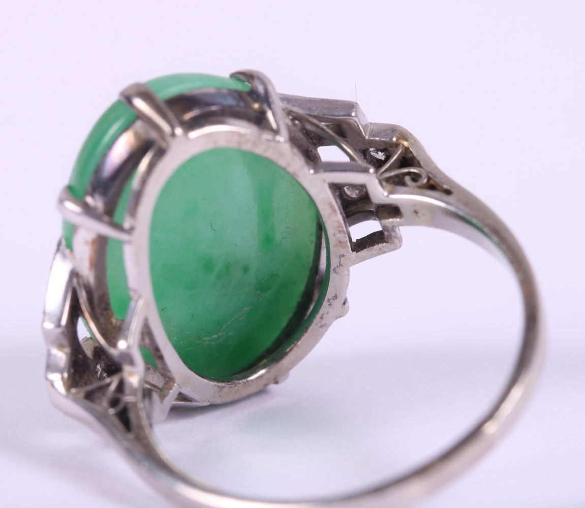 An Art Deco white metal ring, set jade cabochon, flanked three diamonds to each shoulder, ring - Image 3 of 10