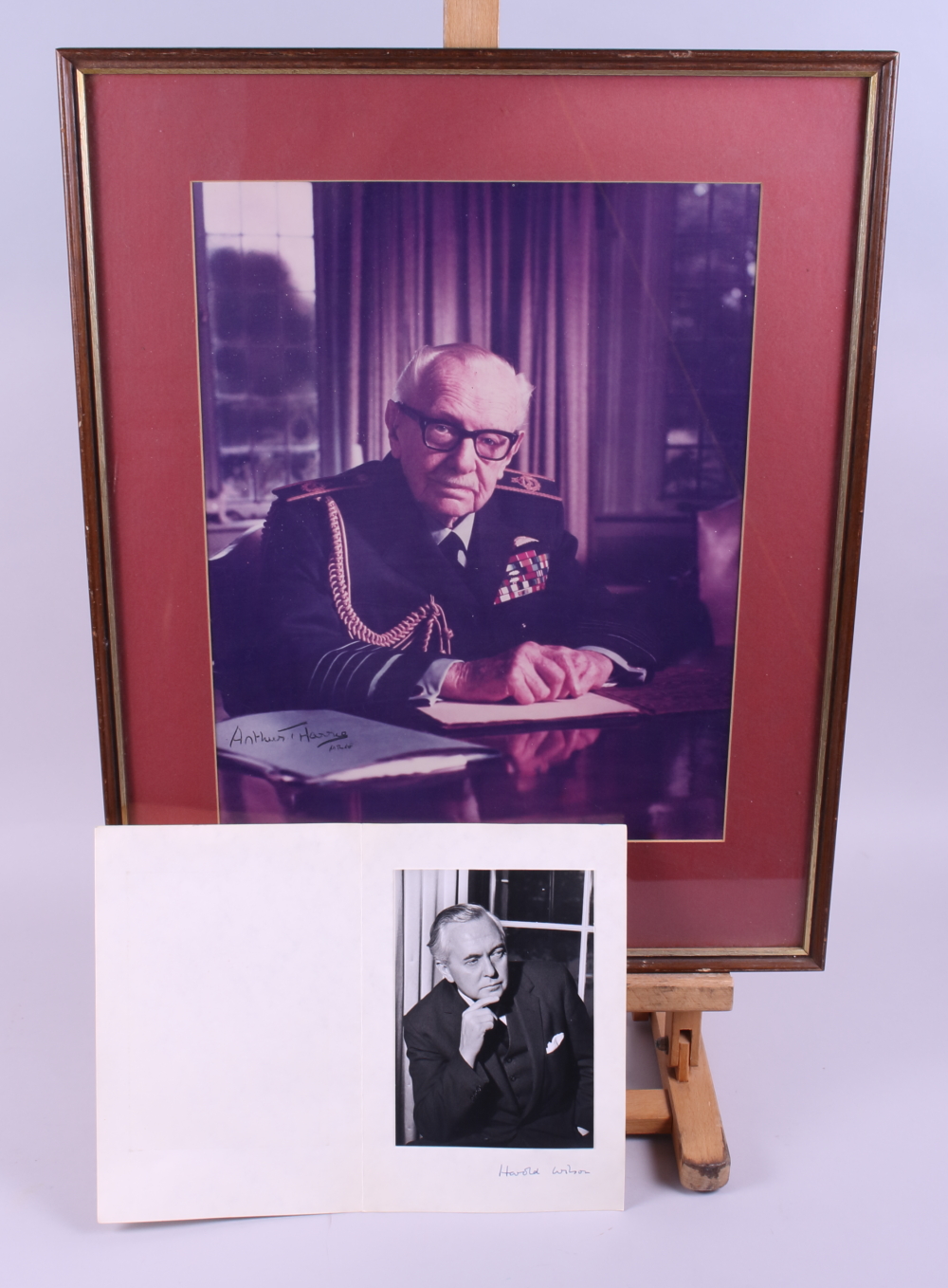 A photograph of Harold Wilson with signature, and a print of Arthur Harris