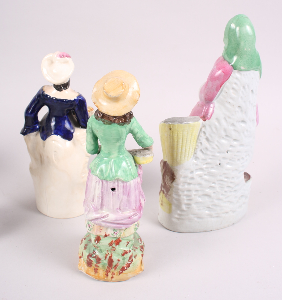 A 19th century Staffordshire figure, fish wife, a smaller figure, Spanish lady, and five other - Image 3 of 7