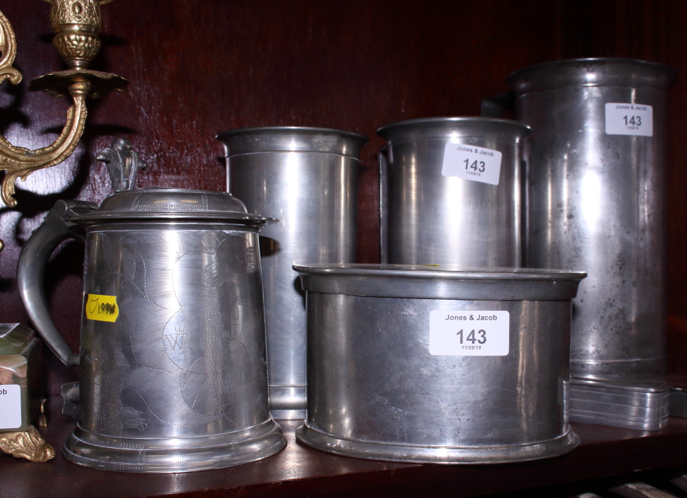 Three Portuguese pewter measures, a pewter oval box and cover, a lidded tankard and two pewter snuff