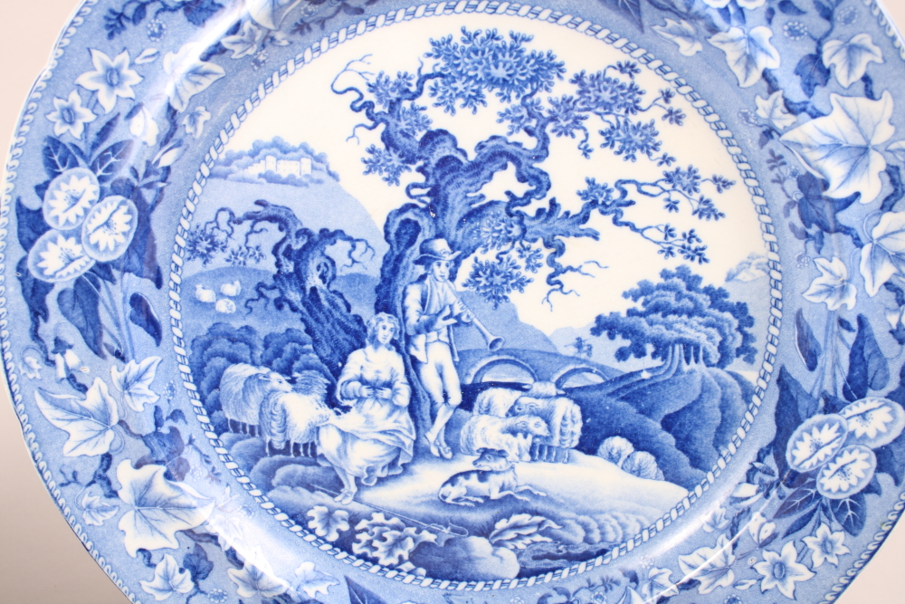 A 19th century blue and white plate, decorated shepherd and shepherdess resting under a tree, and - Image 3 of 5