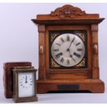 An early 20th century brass cased carriage clock, in leather travel case, and an oak cased bracket