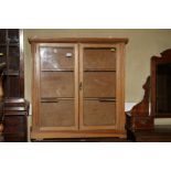 A 19th century waxed pine wall cupboard enclosed glazed panel doors, 33" wide