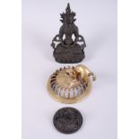 A Tibetan bronzed Buddha, 7 1/2" high, and two pierced jar covers with mythical beasts, 4 1/2"