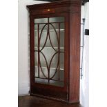 A late 19th century mahogany, box and ebony strung corner cabinet enclosed oval lattice glazed door,