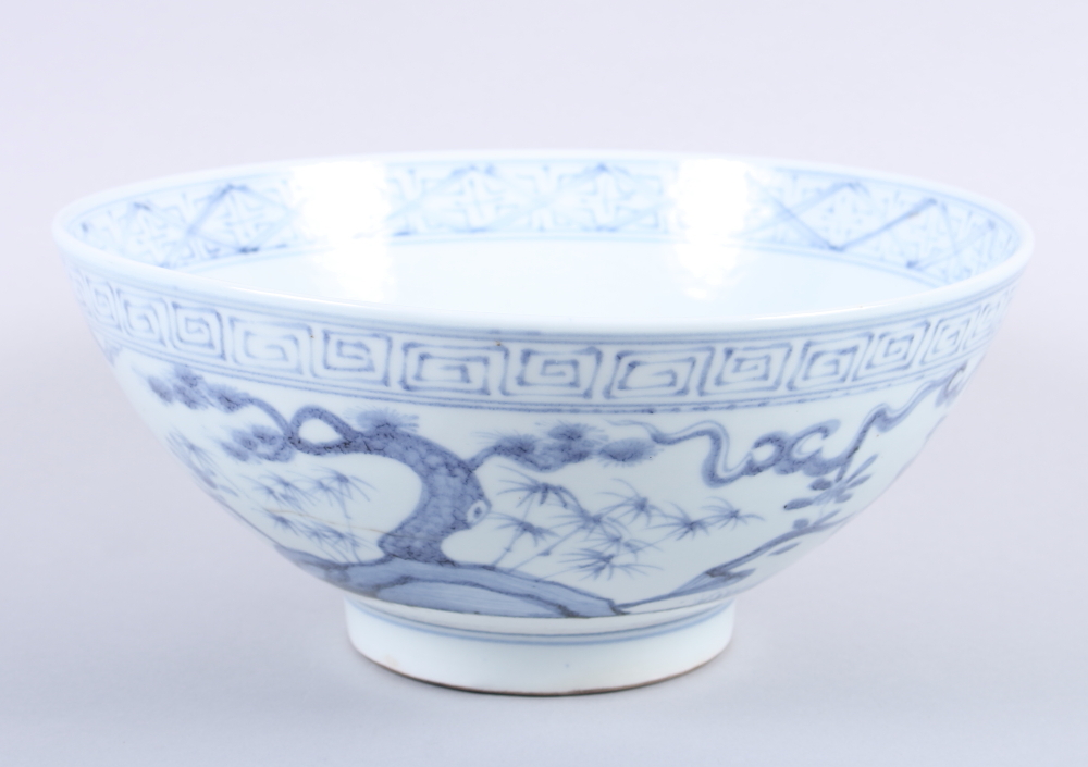 A Chinese blue and white bowl, decorated trees and figures, 4 3/4" high, a Chinese porcelain blue