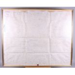 An early 18th century indenture, in gilt strip frame