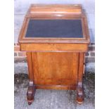 An Edwardian mahogany and walnut banded Davenport with four side drawers, on bun feet, 21 3/4" wide