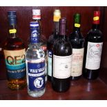 Seven bottles of alcohol, including Chateau Barbe 1993, vodka, etc