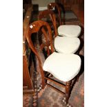 A set of six 19th century loopback dining chairs with stuffed over seats, on bobbin turned supports
