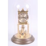 An early 20th century gilt anniversary clock with silvered dial and Arabic numerals