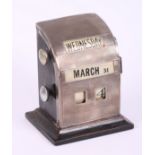 A silver mounted desk calendar with engine turned decoration