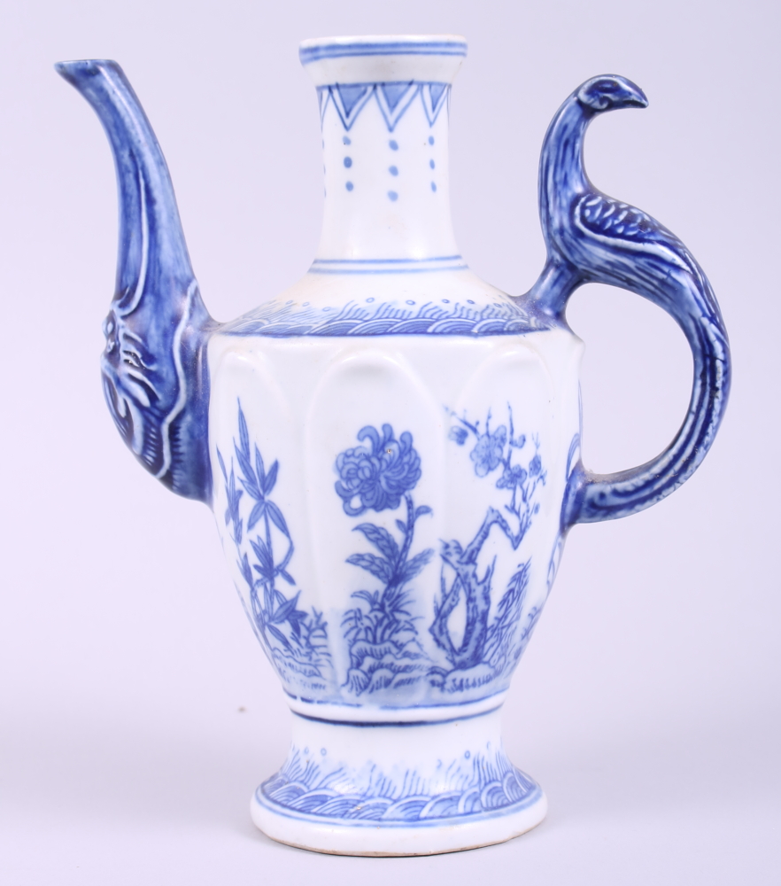 A Chinese blue and white wine pot, decorated plants, with seal mark to base, 7 1/2" high