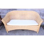 A two-seat wicker settee and a Lloyd Loom design laundry basket, 58" wide