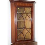 A late 19th century mahogany, box and ebony strung corner cabinet enclosed Gothic lattice glazed