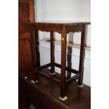 An oak occasional table, on stretchered supports, 22 1/2" wide