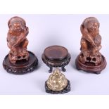 Two Chinese carved fruitwood figures, a brass Buddha, on stand, and three hardwood stands