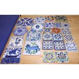 Four delftware tiles, a larger similar tile and a number of other tiles