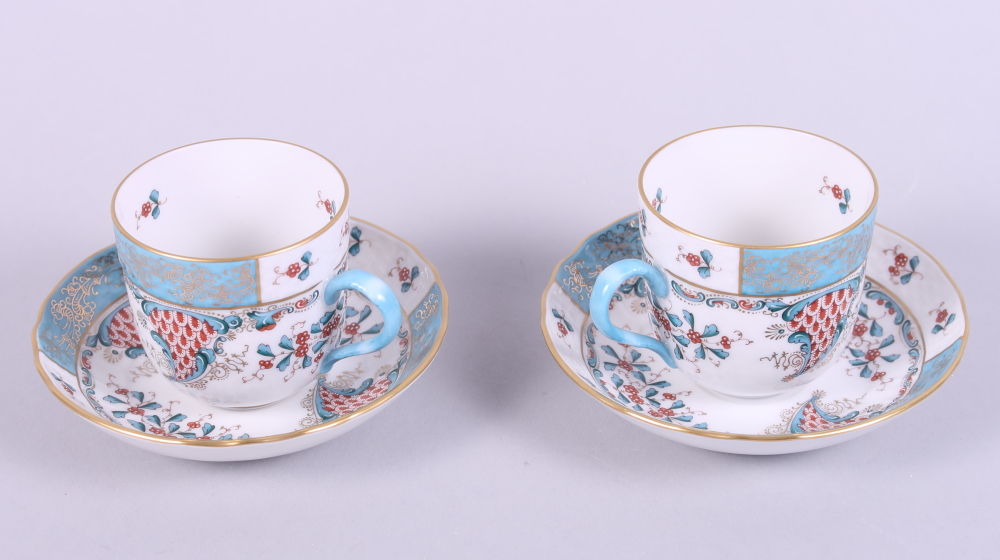 A pair of Herend "Cornucopia" pattern cabinet cups and saucers, hand-painted "Altai Saudonie" to