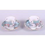 A pair of Herend "Cornucopia" pattern cabinet cups and saucers, hand-painted "Altai Saudonie" to