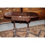 A 19th century figured mahogany drop leaf occasional table, fitted two drawers, on splay supports,