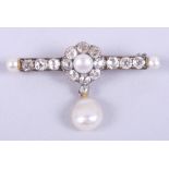 An antique yellow metal brooch, the central cluster set single pearl and eight old cut diamonds,