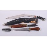 A kukri with engraved blade, a dagger and wooden scabbard and two scout knives
